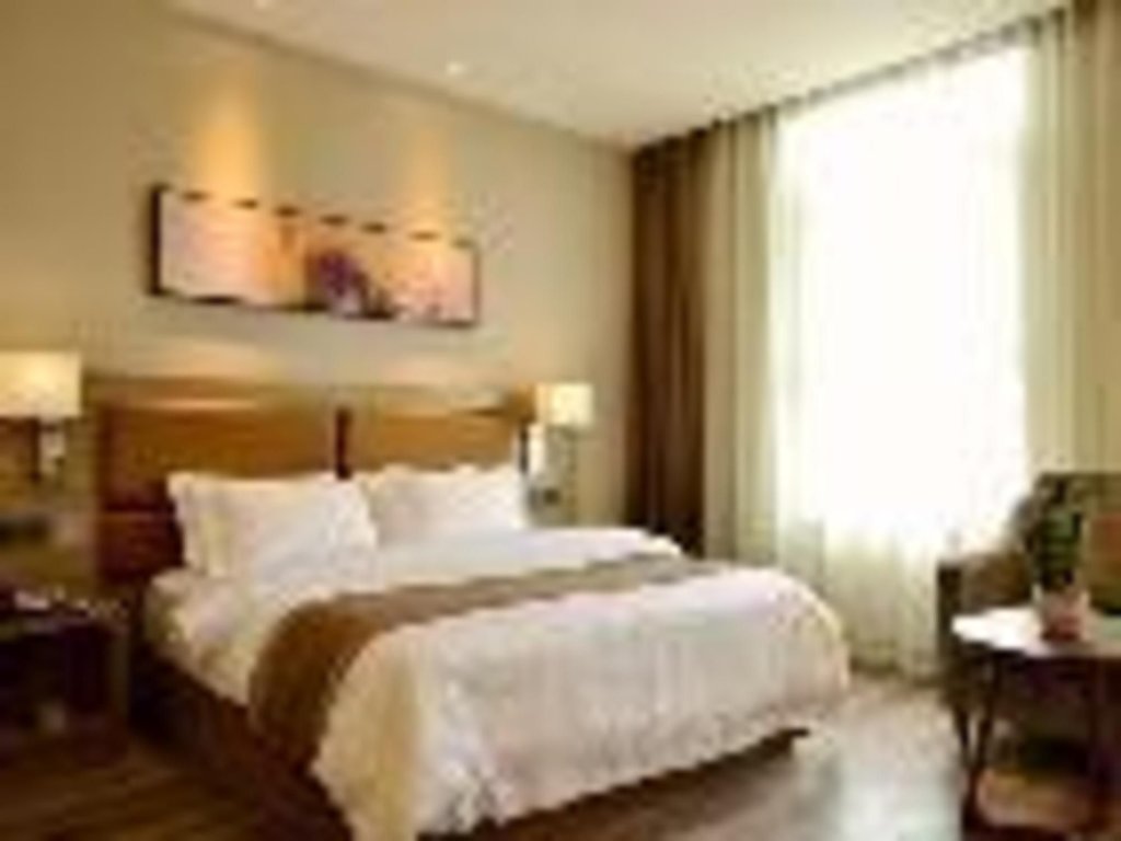 Циндао: Jinjiang Metropolo Hotel - Qingdao Xinduxin