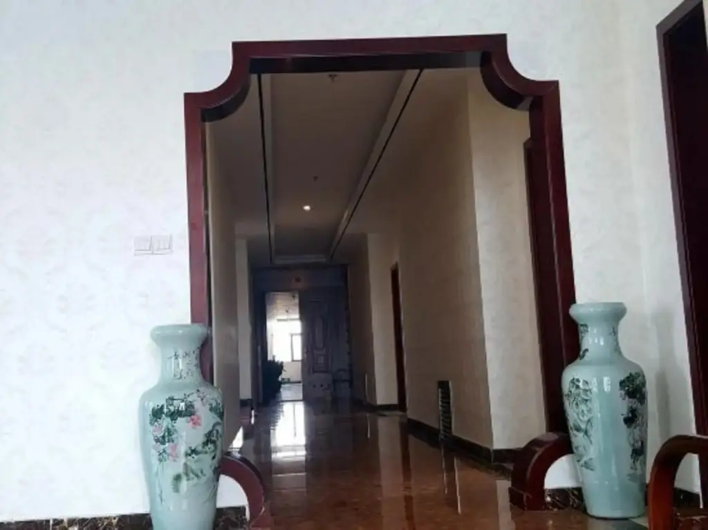 Линьи: Huanle Business Hotel