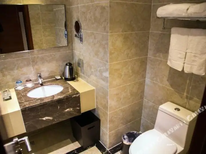 Уси: Huading Business Hotel