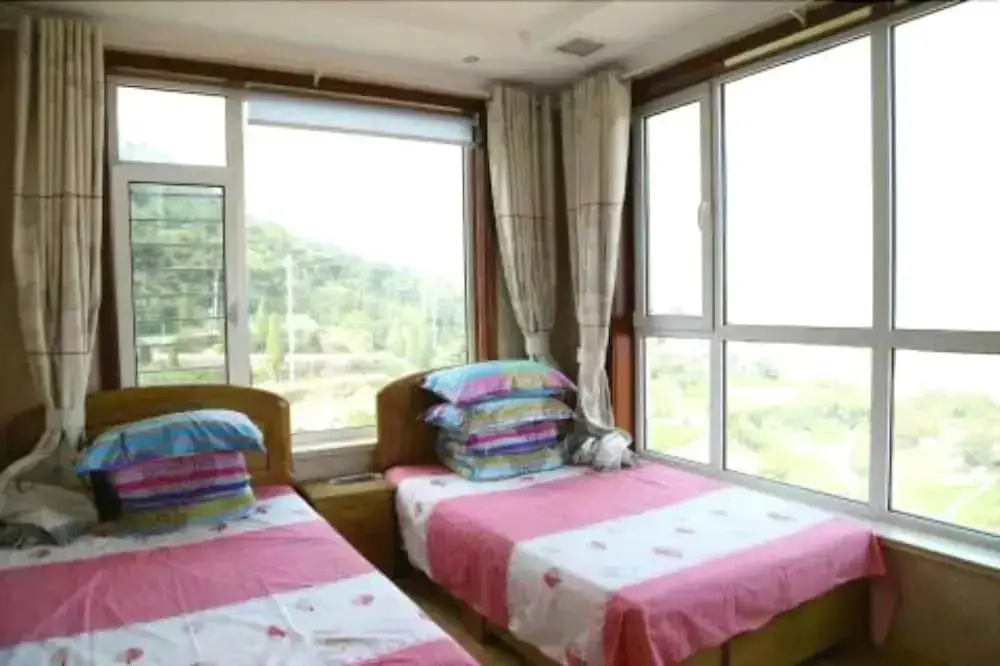 Циндао: Qingdao Paradise Seaview Cottage