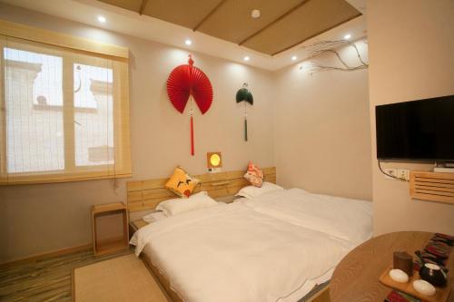 Цзясинь: Tongxiang Wuzhen Linlu Guesthouse