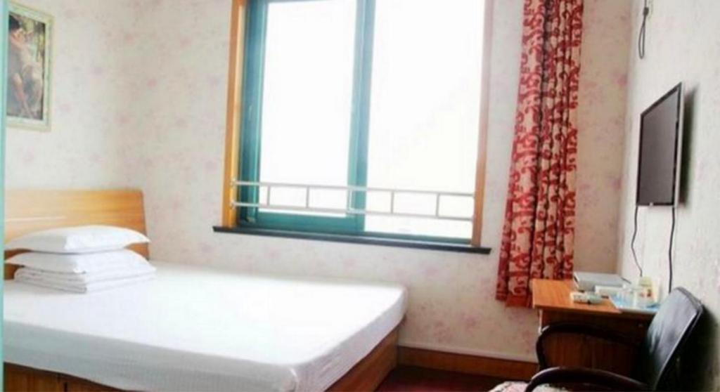 Циндао: Qingdao Ruyi Seaview Express Apartment