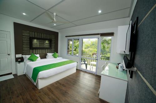 Муннар: Moselberg Riverside Cottages