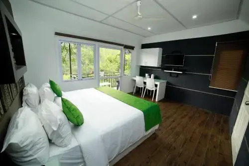 Муннар: Moselberg Riverside Cottages