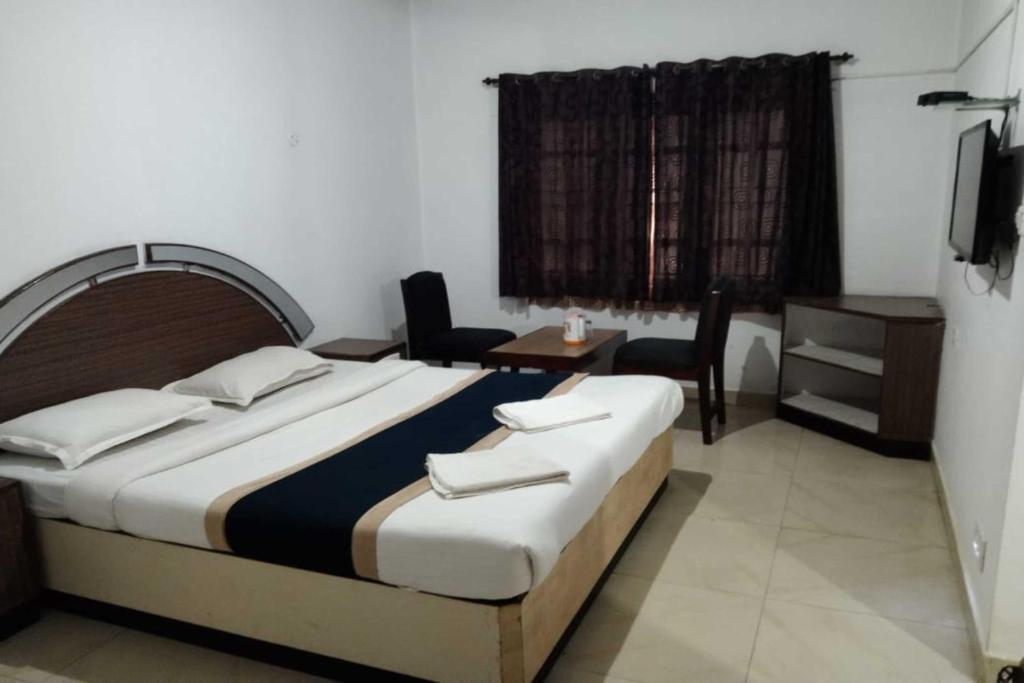Ути: Hotel Orchid Inn