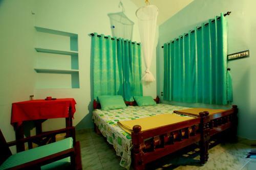 Кумили: House of Blue Mangoes