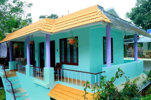 Кумили: House of Blue Mangoes