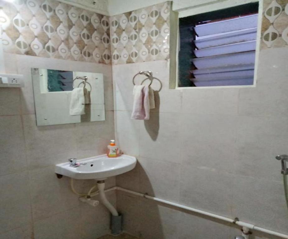 Пляж Ганпатипуле: Whistling Farms Home Stay