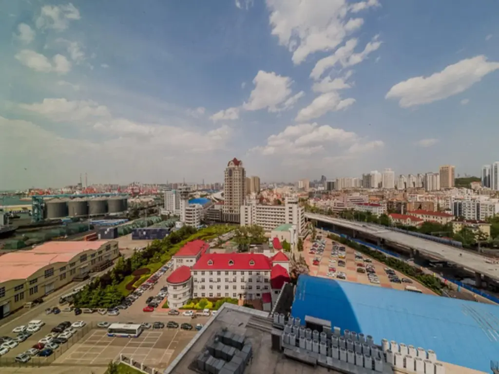 Циндао: Qingdao Yujia Apartment