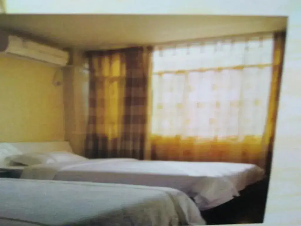 Мяньян: Beichuan Yijia Business Inn