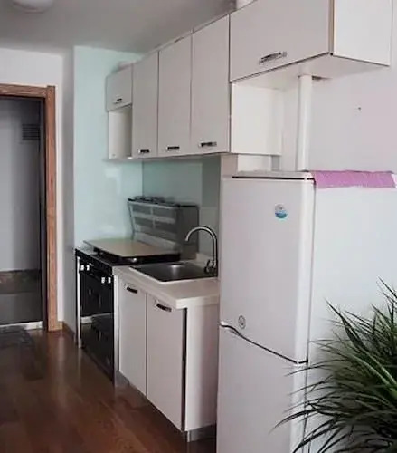 Далянь: Dalian Shangpinzhijia Apartment