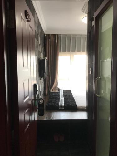 Далянь: Shangpin Gongchang Boutique Apartment