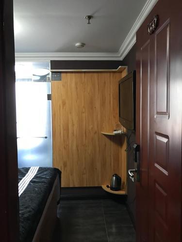 Далянь: Shangpin Gongchang Boutique Apartment