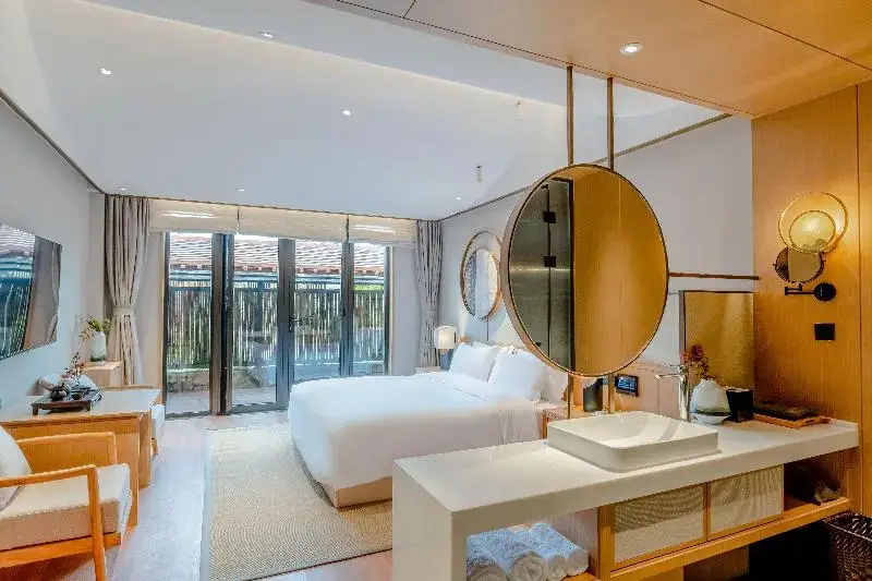 Циндао: Blossom Hill Hotel Qingdao Aduohuayu