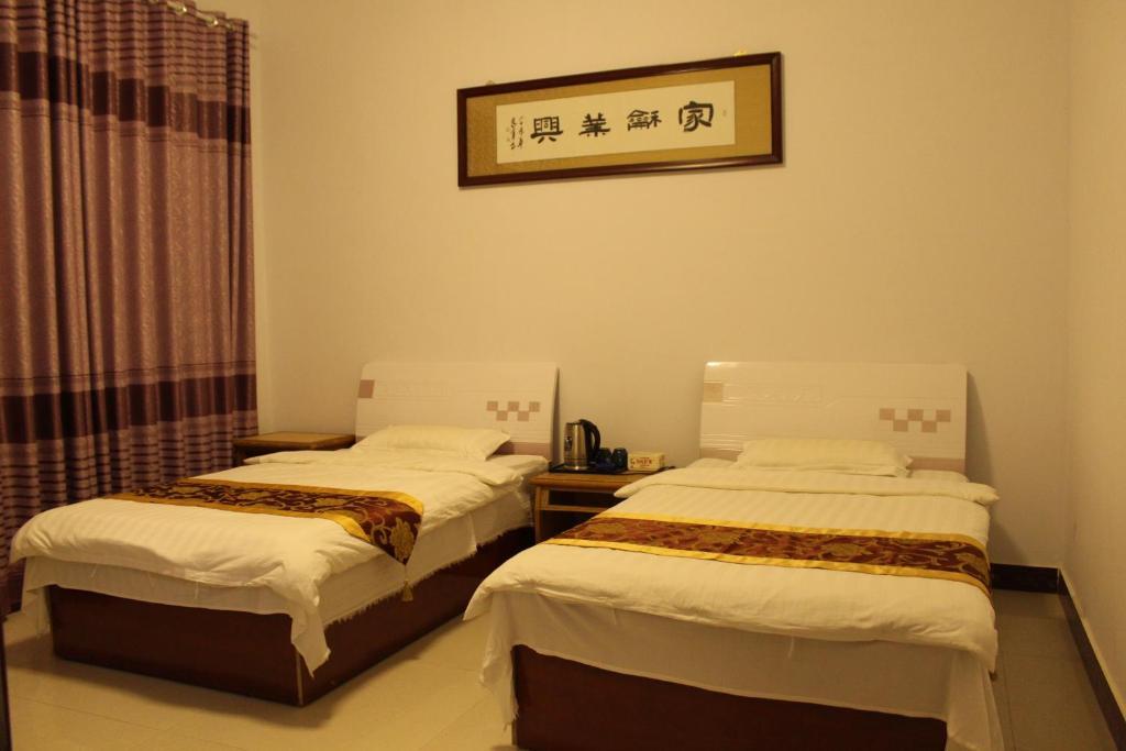 Цзюцюань: Dunhuang Happy Yijia Guest House