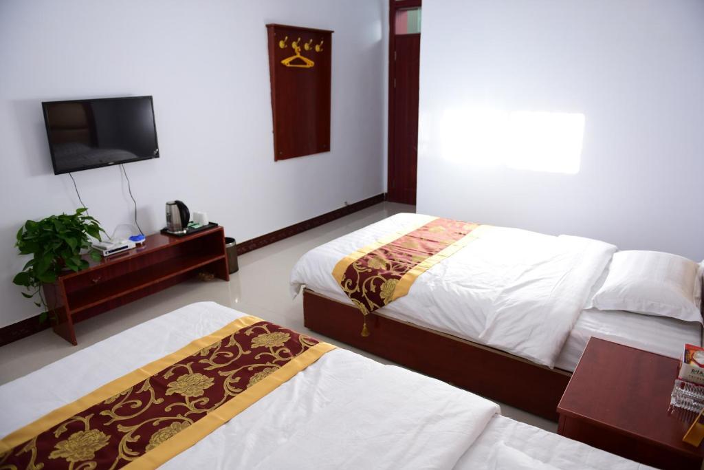 Цзюцюань: Dunhuang Happy Yijia Guest House