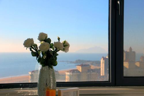Циндао: Qingdao Getoom Golden Beach Apartment