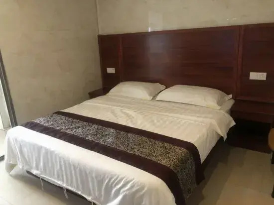 Чжуншань: Zhongshan Junyi Business Apartment