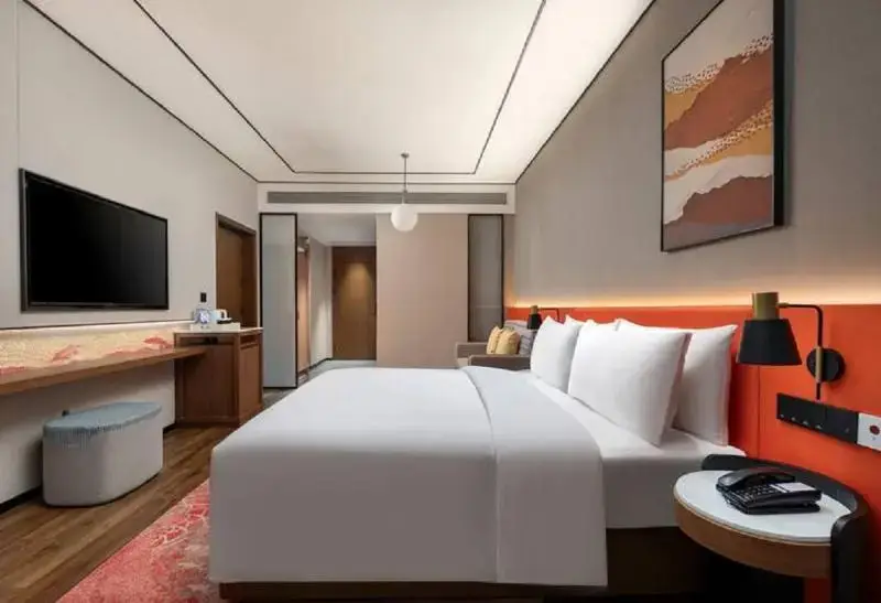 Синъи: Hilton Garden Inn Xingyi Wanfenglin