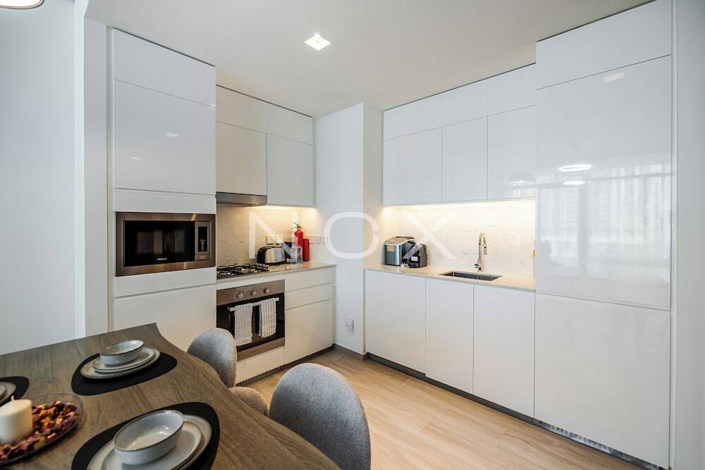 Дубай: Elegant 1BR Palace Residence