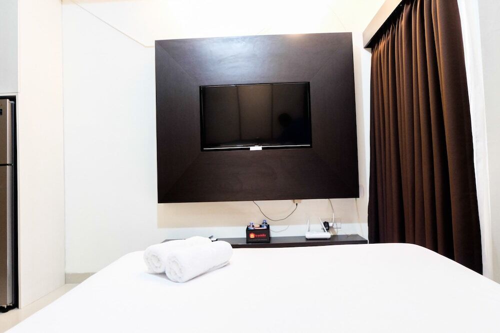 Чикаранг: Warm and Homey Studio at The Oasis Cikarang Apartment By Travelio