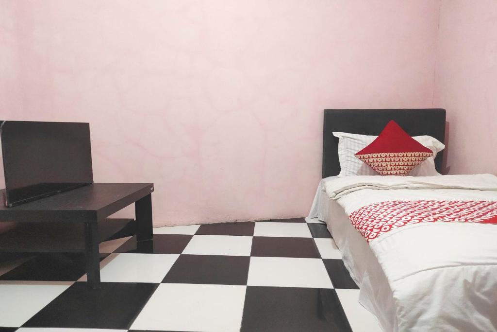 Депок: Oyo 90323 Wisma Puspita Syariah