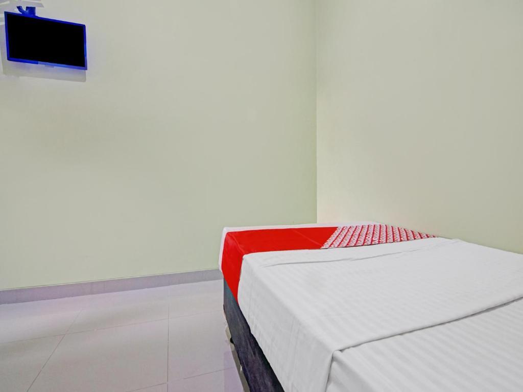 Южный Тангеранг: OYO 90409 Kostawira Residence Syariah