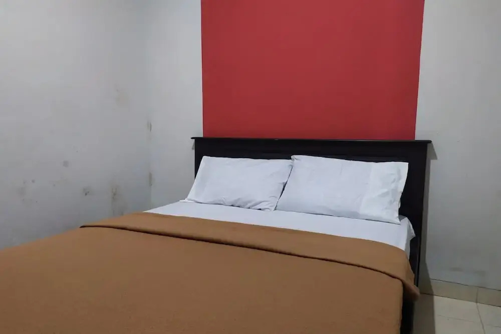 Джакарта: OYO 2654 Yulia Guesthouse Near Kopi Bajawa Flores NTT Tebet