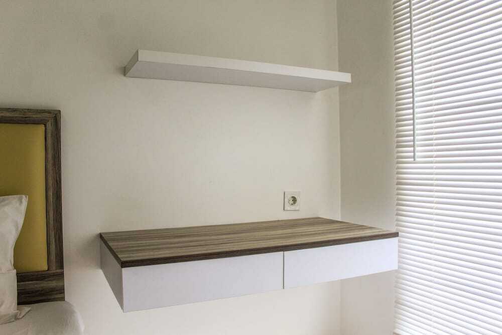 Legok: Relaxing 2BR Apartment at M-Town Residence By Travelio