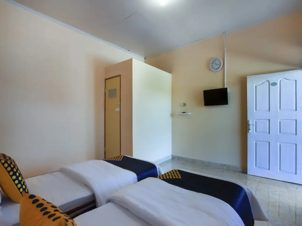 Паданг: Harland Guesthouse by OYO Rooms