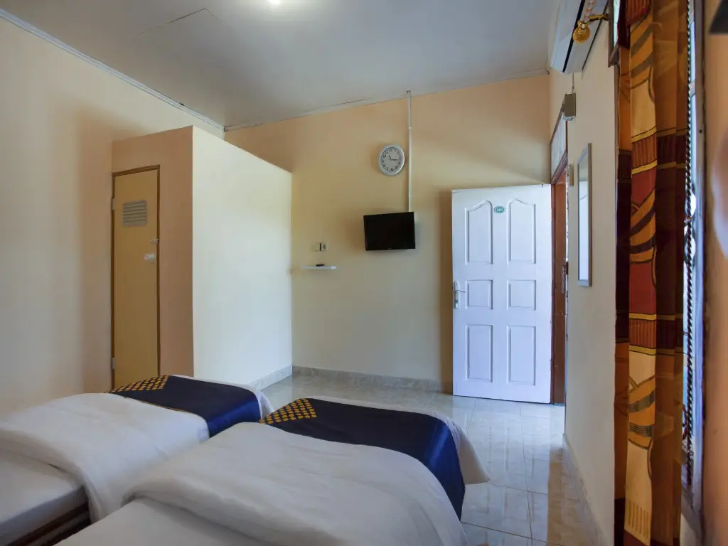 Паданг: Harland Guesthouse by OYO Rooms