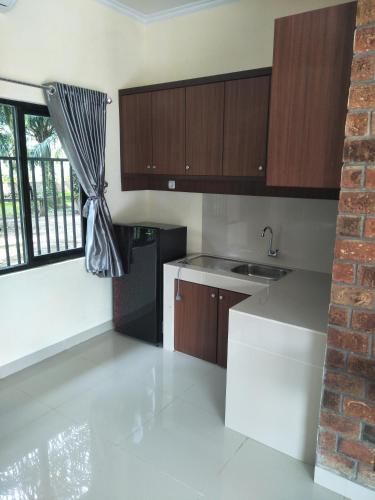 Петумбак: Hotel Rumah Kost Kualanamu