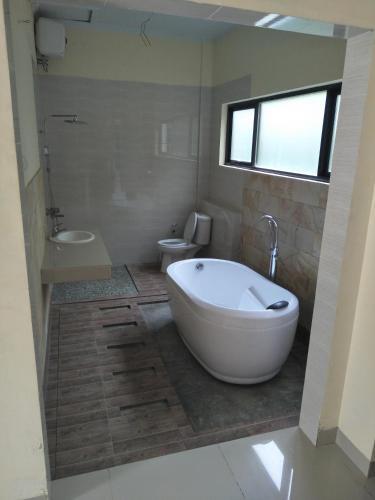 Петумбак: Hotel Rumah Kost Kualanamu