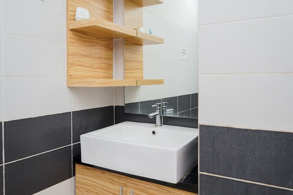 Legok: Cozy 1BR Scientia Residence Apartment near Summarecon Mall Gading Serpong By Travelio