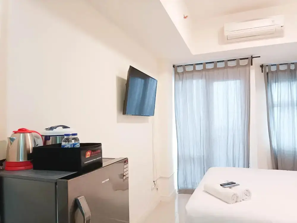 Макассар: Cozy And High Floor Studio Room At Vida View Makassar Apartment