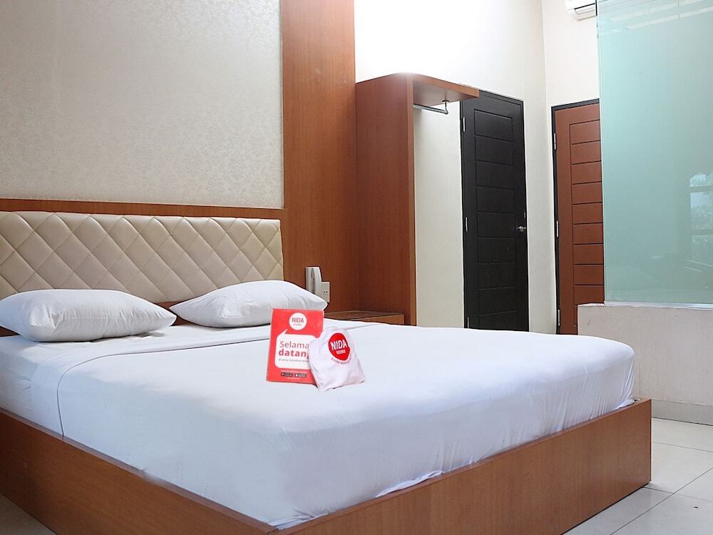 Петумбак: Nida Rooms Pasar Buah Medan Tuntungan