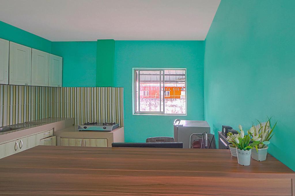 Медан: OYO 90637 Rumah Ni Karo