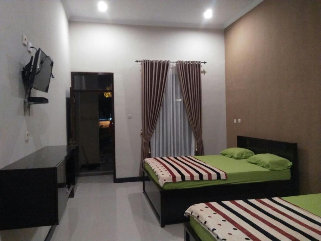 Батукарас: Sederhana Homestay