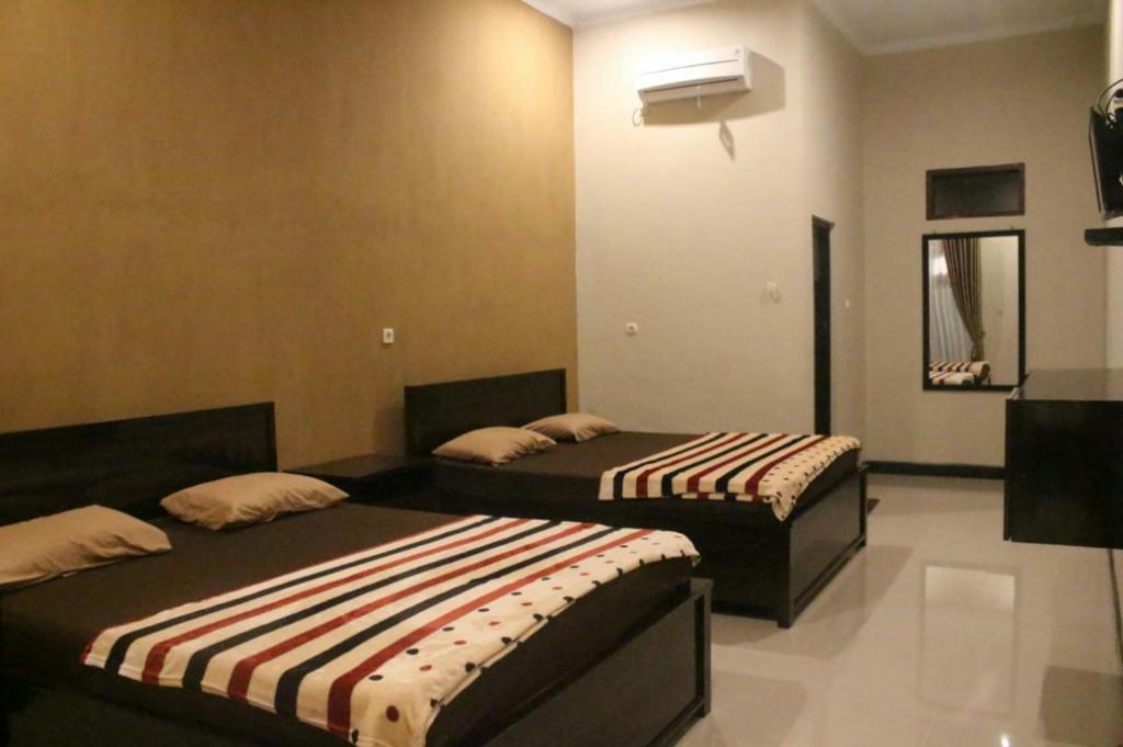 Батукарас: Sederhana Homestay