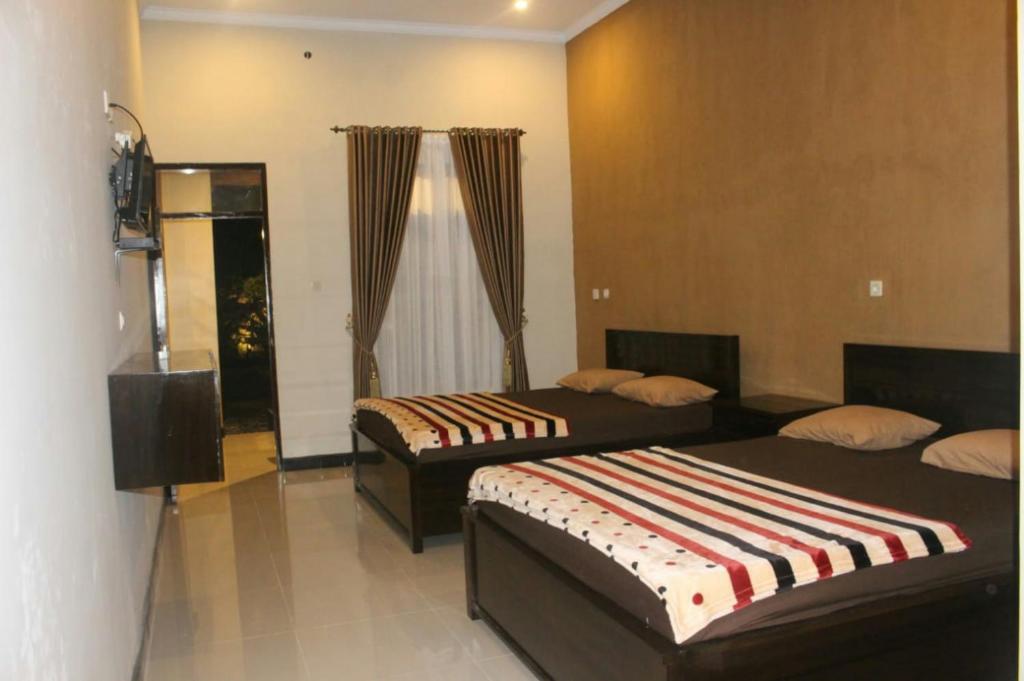 Батукарас: Sederhana Homestay