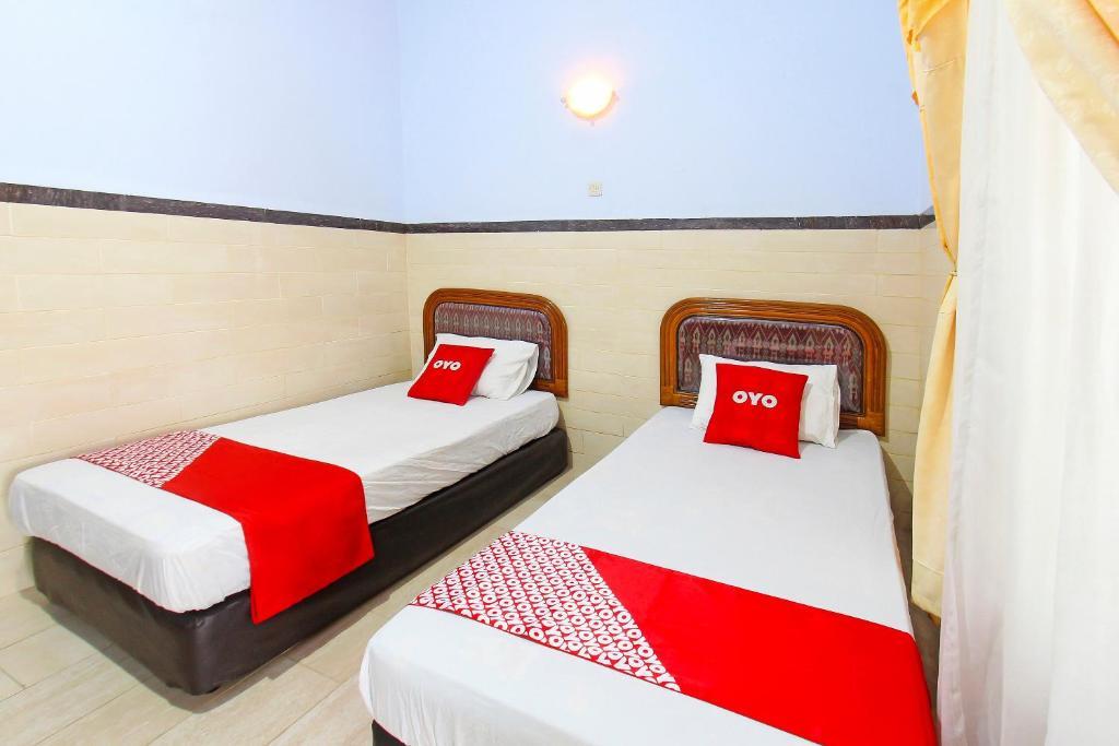 Матарам: OYO 91516 Wisata Hotel