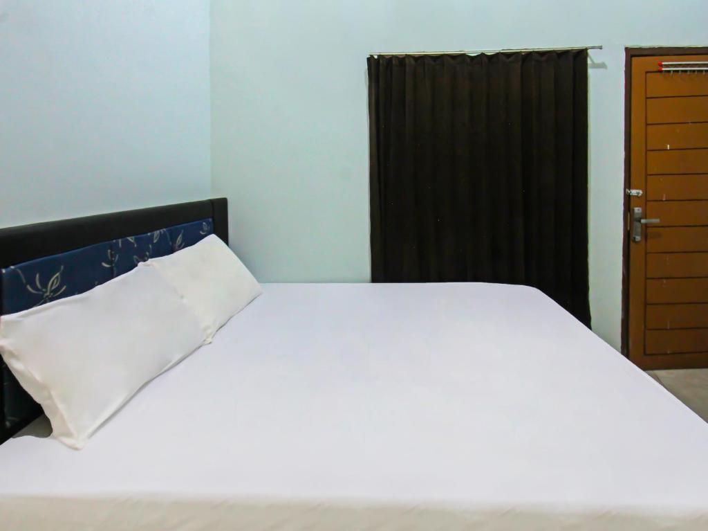 Прайя: OYO 92095 Wisma Dhana Syariah