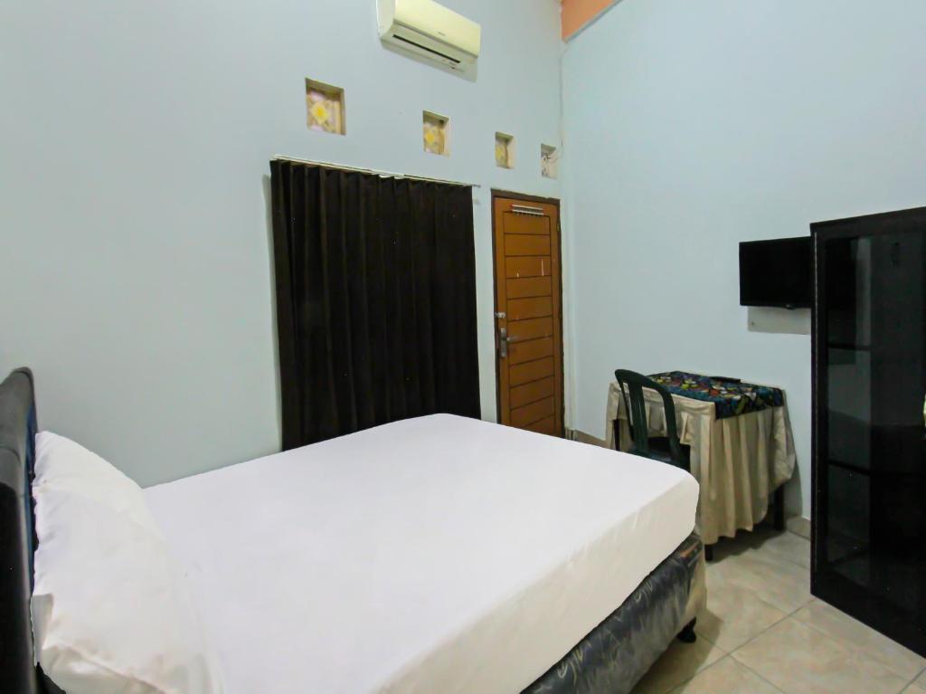 Прайя: OYO 92095 Wisma Dhana Syariah