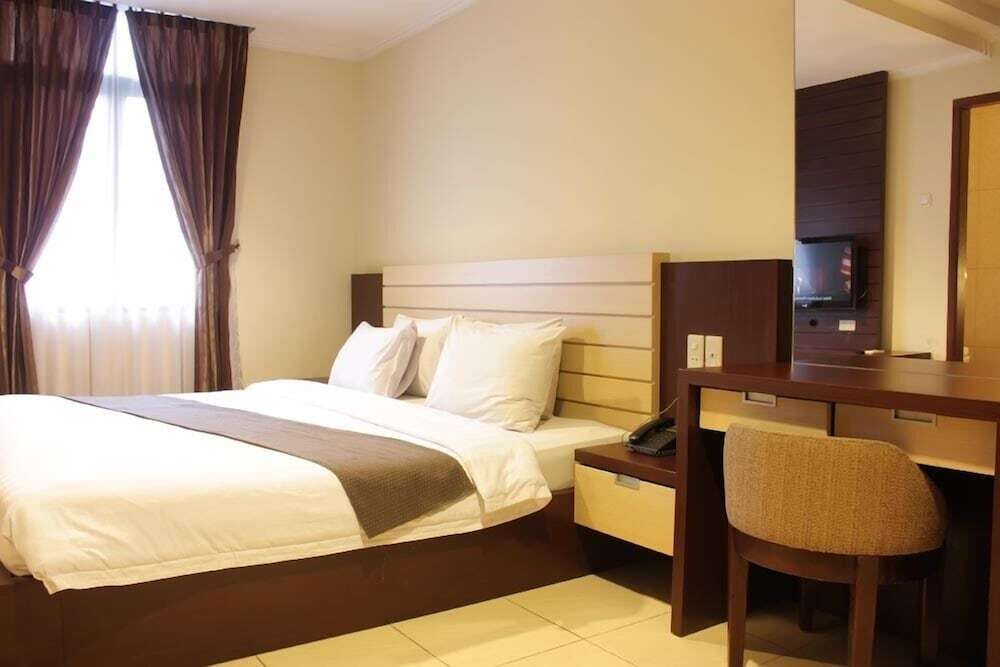 Медан: Travellers Suites