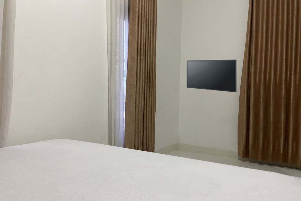 Сентани: OYO 93485 Hotel Kenzie Sentani