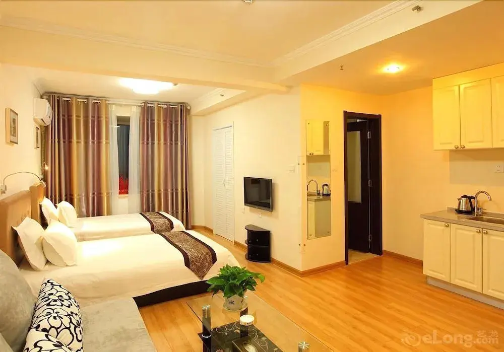 Циндао: Qingdao Xinlong Holiday Apartment