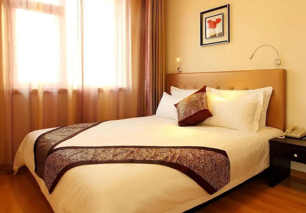 Циндао: Qingdao Xinlong Holiday Apartment