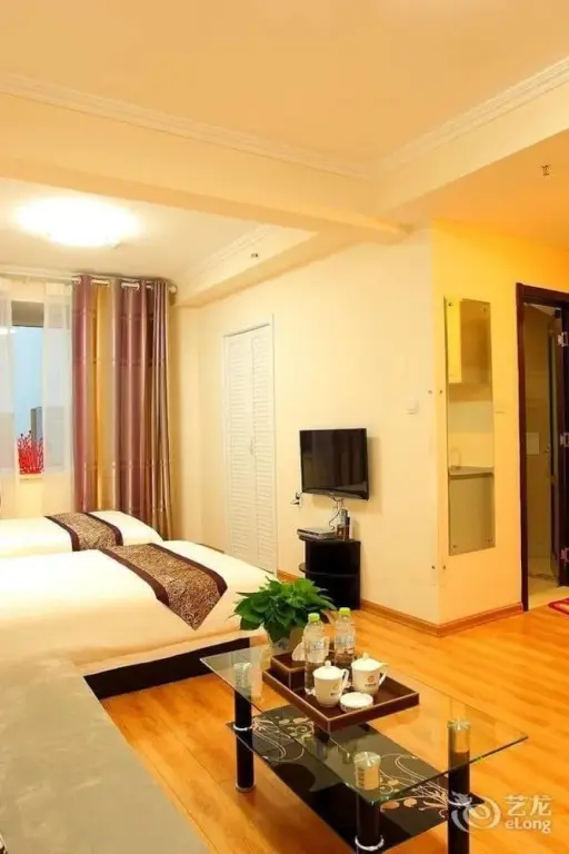 Циндао: Qingdao Xinlong Holiday Apartment